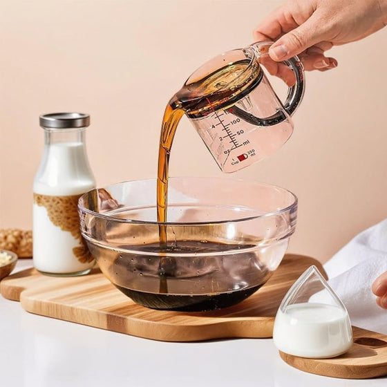 Multifunktionell integrerad justerbar måttkopp