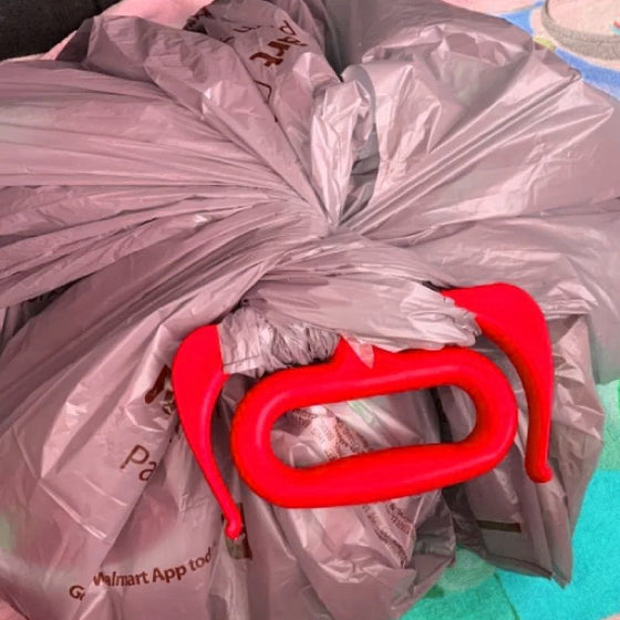 Multifunktionell handtagshållare för matkassar