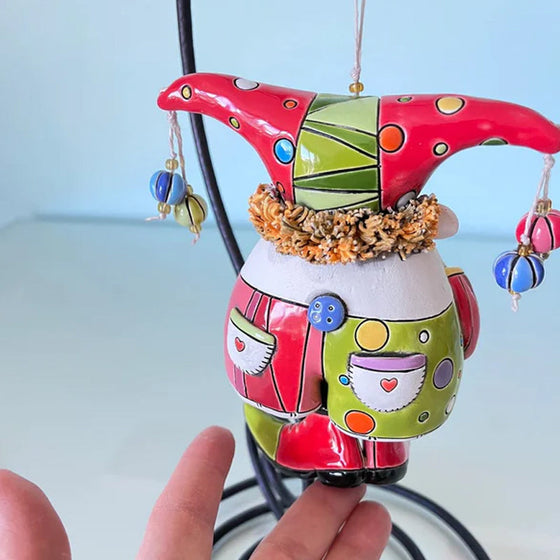 Färgglada ornament med narrklocka