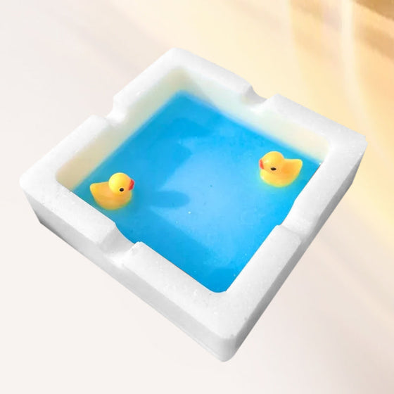 En askkopp formad som en badank