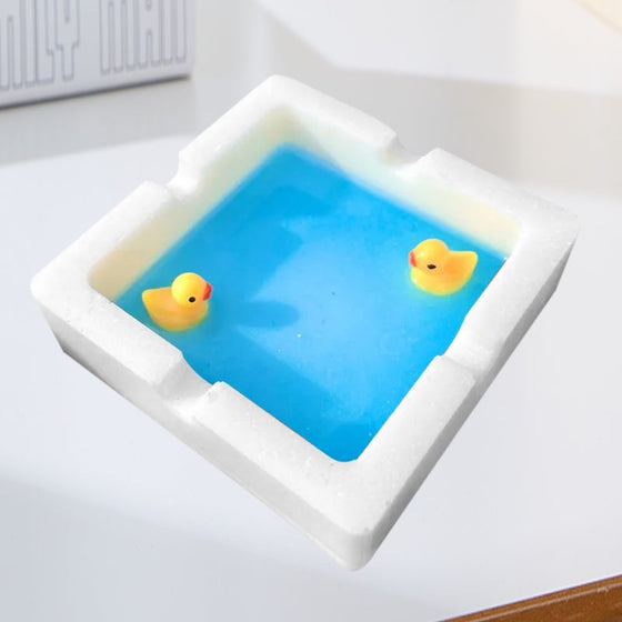 En askkopp formad som en badank