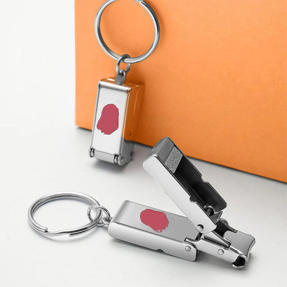 Bärbar mini hopfällbar nagelklippare