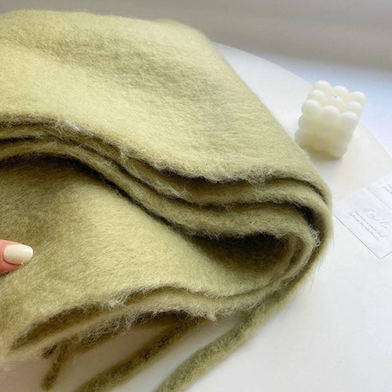 Damens enfärgade grova halsduk med tofsar