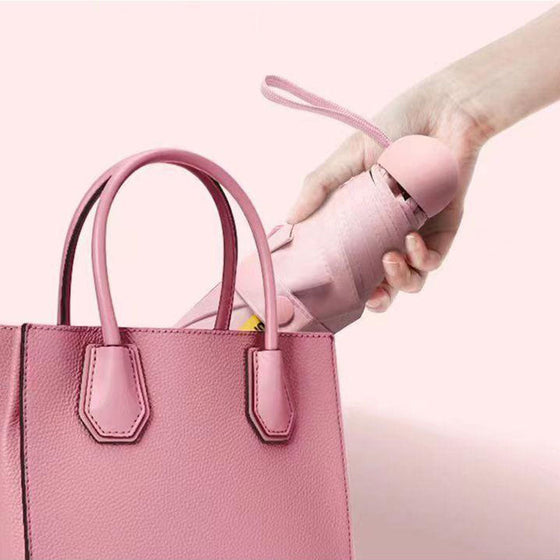 Fickparaply med sol- och regnskydd