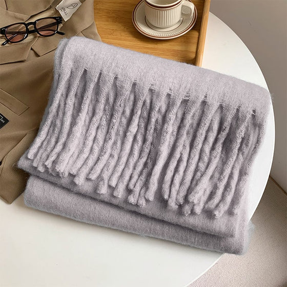 Damens enfärgade grova halsduk med tofsar