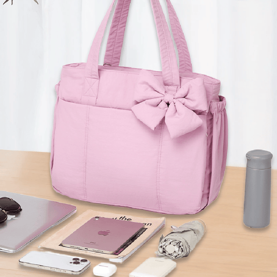 Vadderad väska med stor kapacitet och rosett