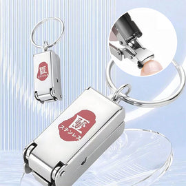 Bärbar mini hopfällbar nagelklippare