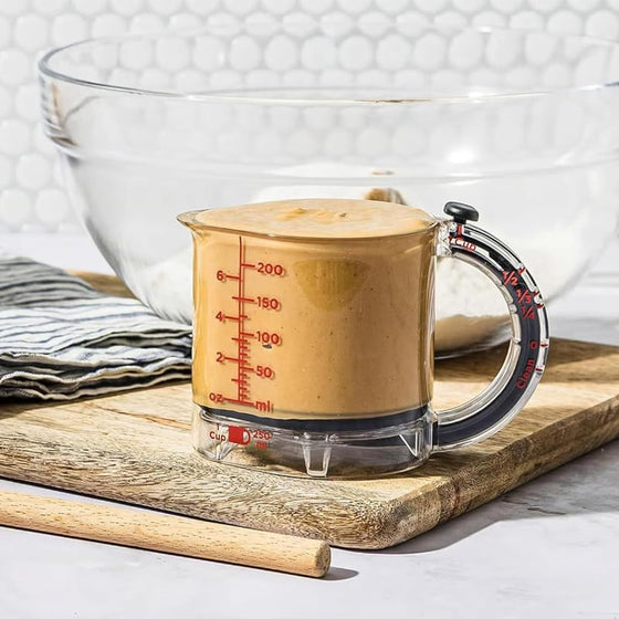 Multifunktionell integrerad justerbar måttkopp