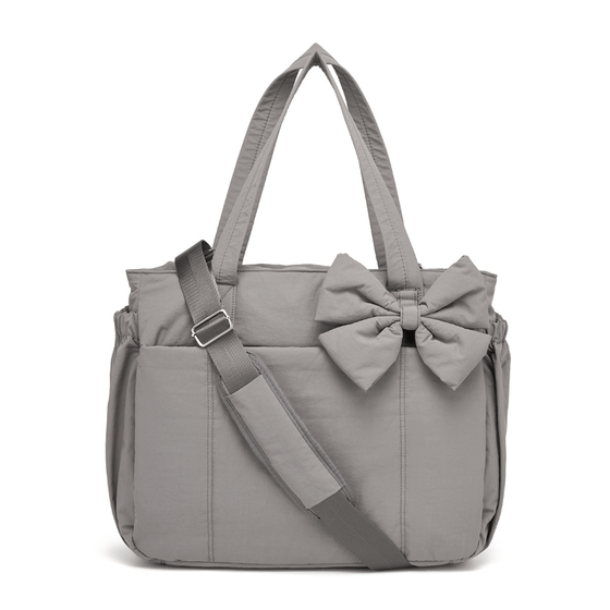 Vadderad väska med stor kapacitet och rosett