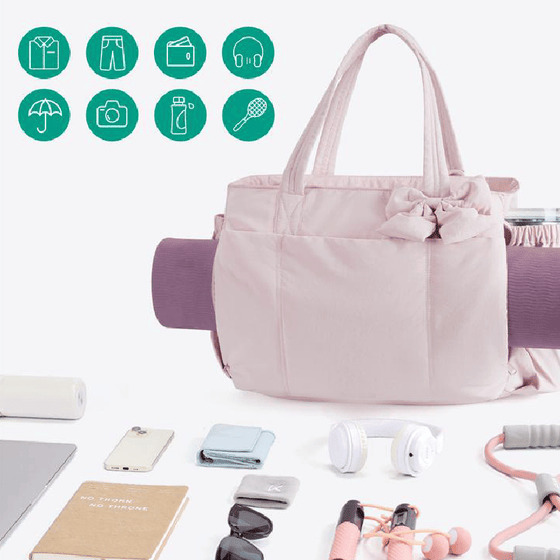 Vadderad väska med stor kapacitet och rosett