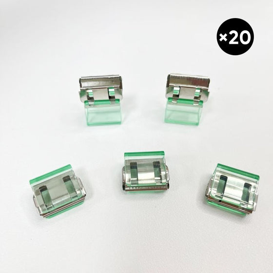 Färgglada små pappersklämmor