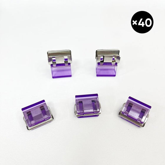 Färgglada små pappersklämmor