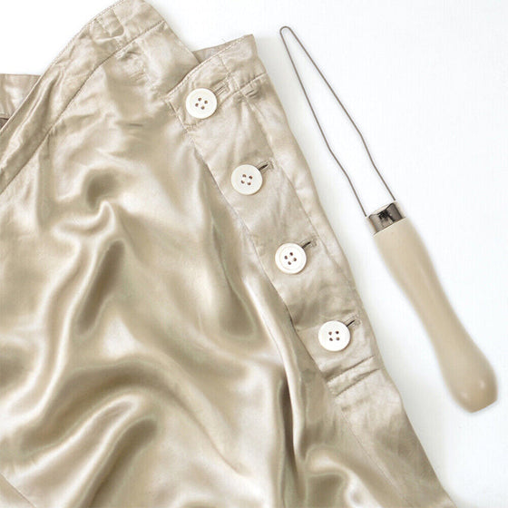 Knappkrokhjälpmedel