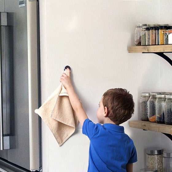 Kreative väggmonterad självhäftande handduksställ utan spik