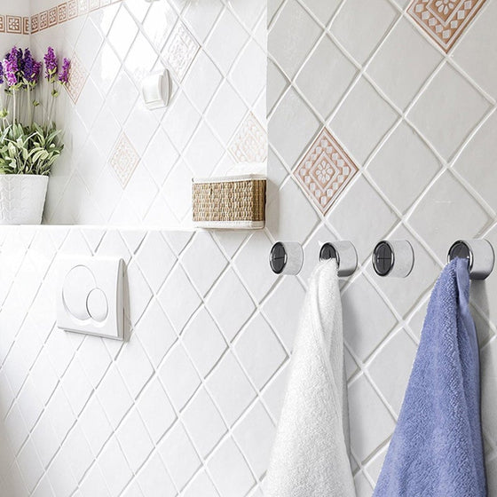 Kreative väggmonterad självhäftande handduksställ utan spik