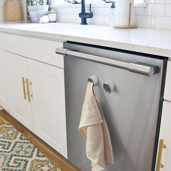 Kreative väggmonterad självhäftande handduksställ utan spik