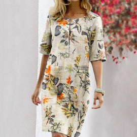 Blommig klänning med halva ärmar