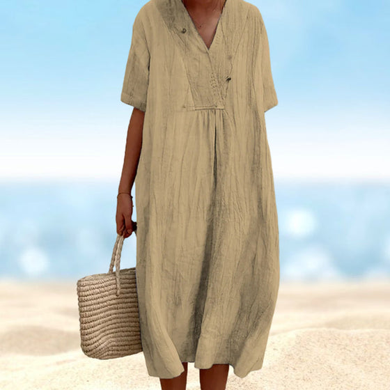 Enfärgad Klänning med V-ringad hals med kortärmad design.