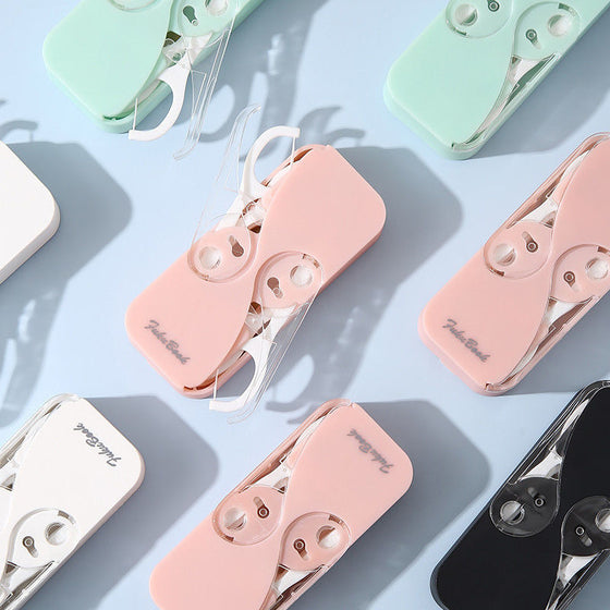 Bärbar tandtrådsdispenser