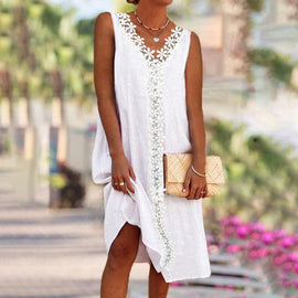 Ärmlös spetsklänning