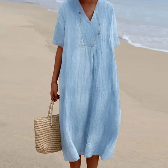 Enfärgad Klänning med V-ringad hals med kortärmad design.