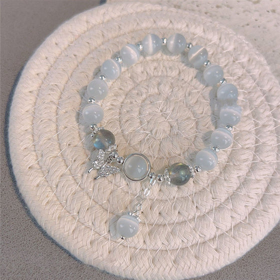 Imiterande kattögonkristallfjärilssmycke