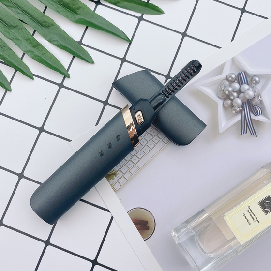 Elektrisk uppvärmd ögonfransböjare