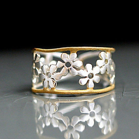 Oregelbunden ihålig tusensköna ring