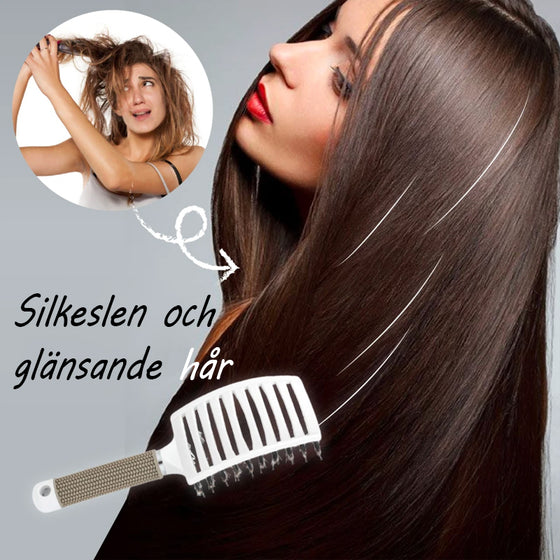 Hårborste med ergonomiskt handtag