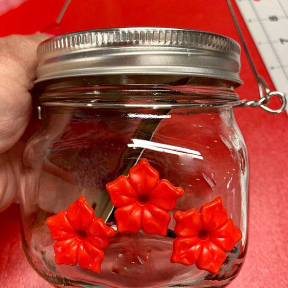 Underbar stenhuggare jar kolibrimatare