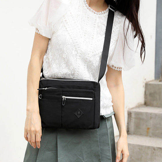 Lätt axelväska med flera fickor för kvinnor