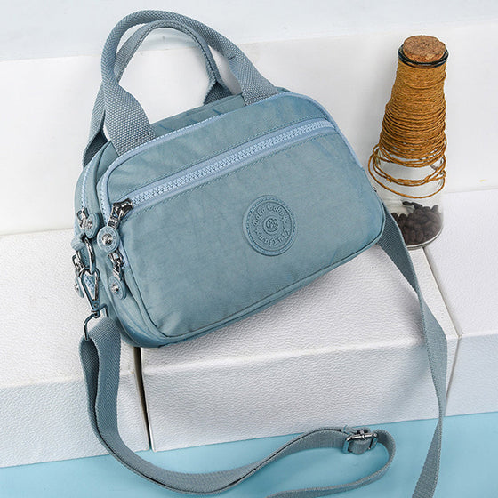 Handväska med flera fack