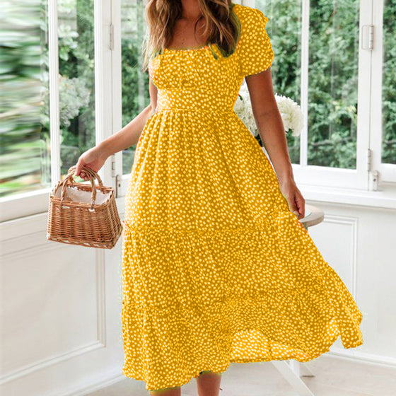 Blommig klänning med fyrkantig hals