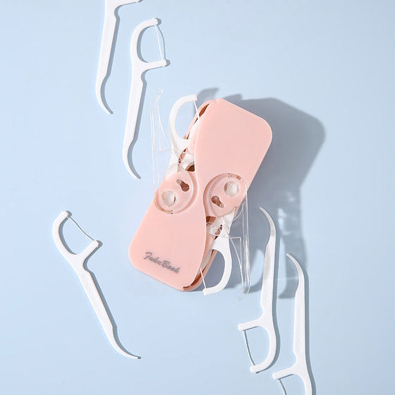 Bärbar tandtrådsdispenser