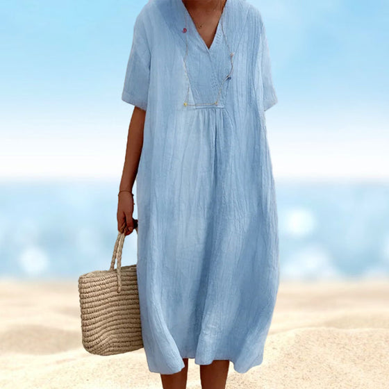 Enfärgad Klänning med V-ringad hals med kortärmad design.