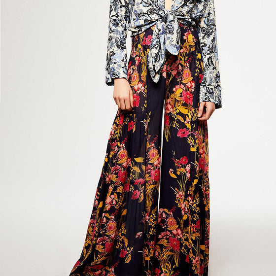 Blommiga avslappnade spetsbyxor med vida ben