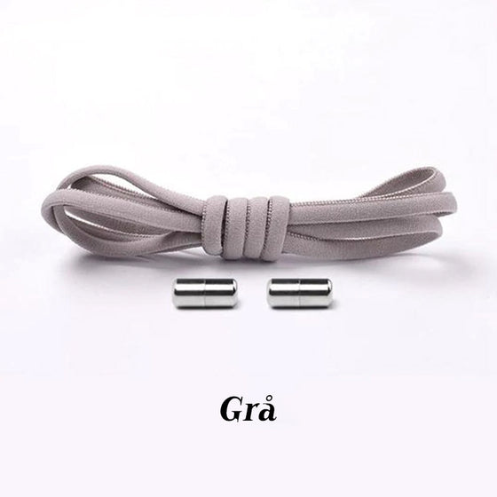 Inga knytskosnören med metallkapsel