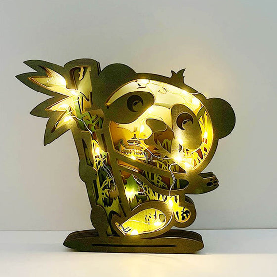 Djurprydnad i snidat trä (med ljus)