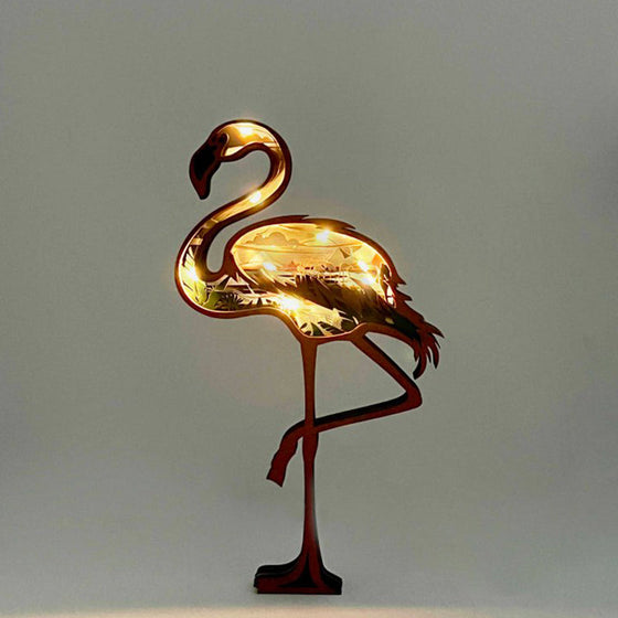 Djurprydnad i snidat trä (med ljus)