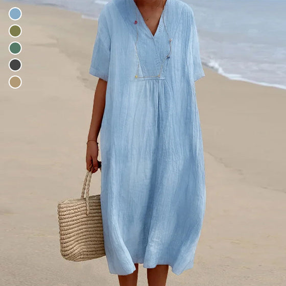 Enfärgad Klänning med V-ringad hals med kortärmad design.