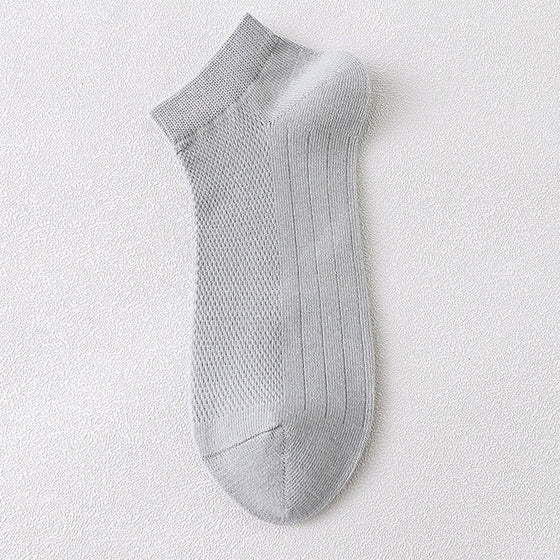 Herrstrumpor i andningsbart material för att motverka dålig lukt