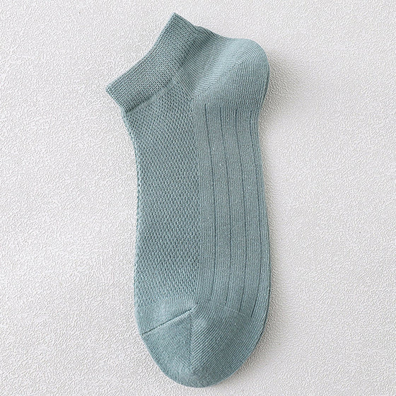 Herrstrumpor i andningsbart material för att motverka dålig lukt